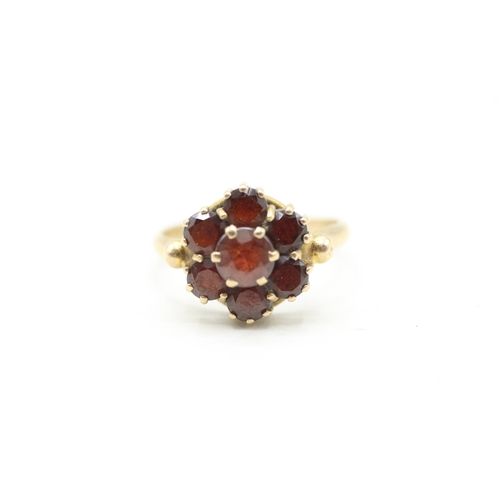 118 - 9ct gold garnet halo ring (2.9g) Size M