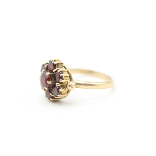 118 - 9ct gold garnet halo ring (2.9g) Size M