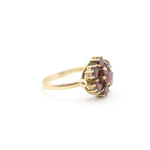 118 - 9ct gold garnet halo ring (2.9g) Size M