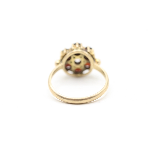 118 - 9ct gold garnet halo ring (2.9g) Size M