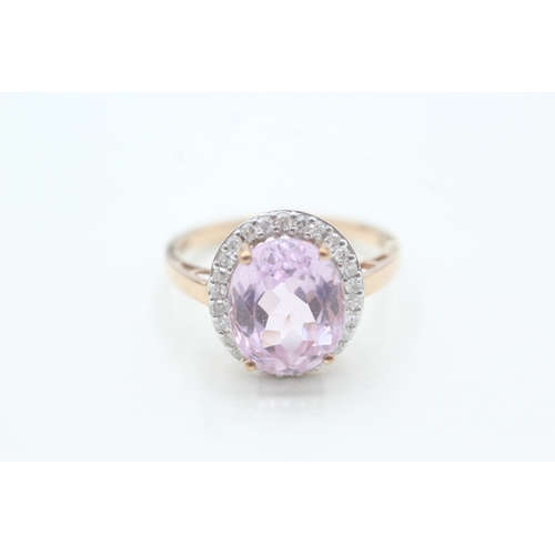 123 - 9ct gold kunzite and diamond halo set ring (4.3g) Size T