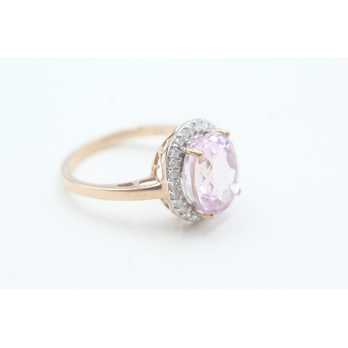 123 - 9ct gold kunzite and diamond halo set ring (4.3g) Size T