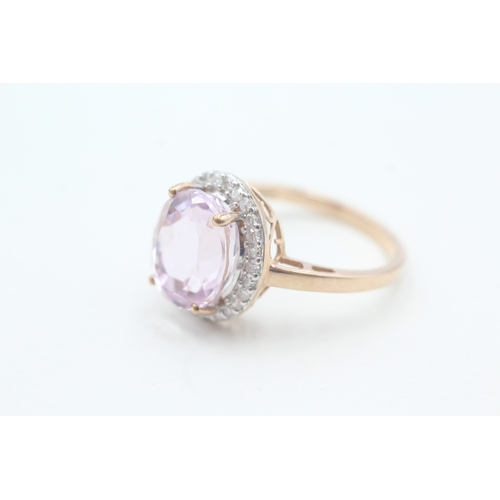 123 - 9ct gold kunzite and diamond halo set ring (4.3g) Size T