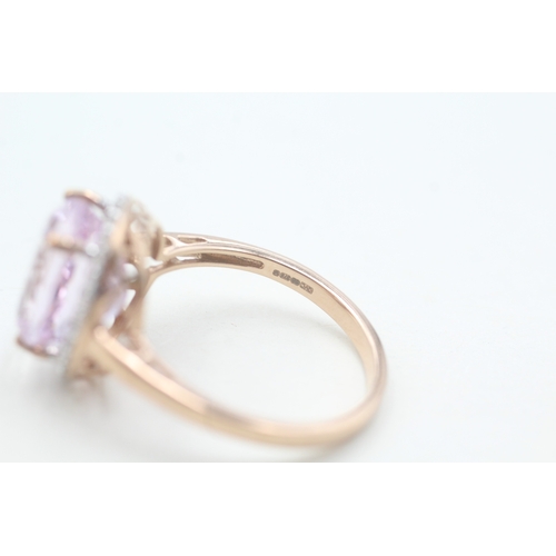 123 - 9ct gold kunzite and diamond halo set ring (4.3g) Size T