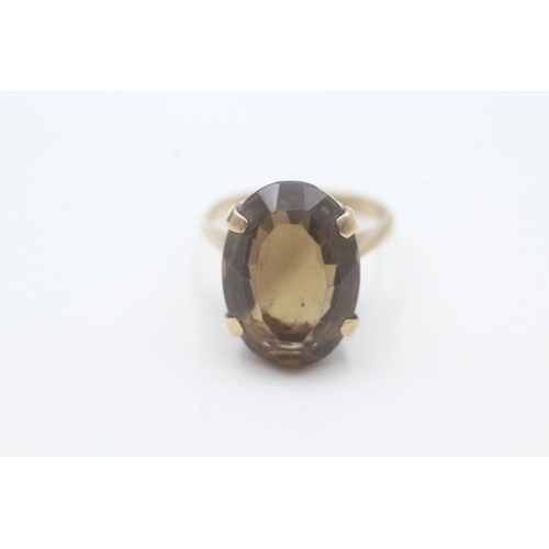 137 - 9ct gold smokey quartz cocktail ring (5.6g) Size P