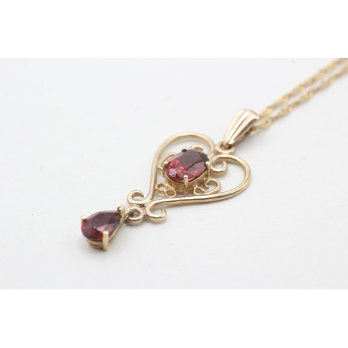 167 - 9ct gold garnet pendant necklace (2.4g)