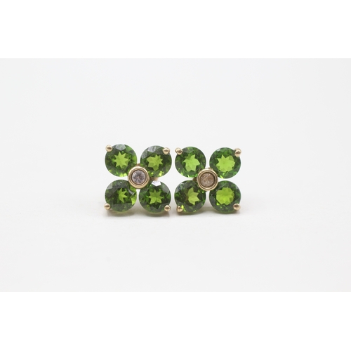 185 - 9ct gold diopside and white gemstone flower stud earrings (2.4g)