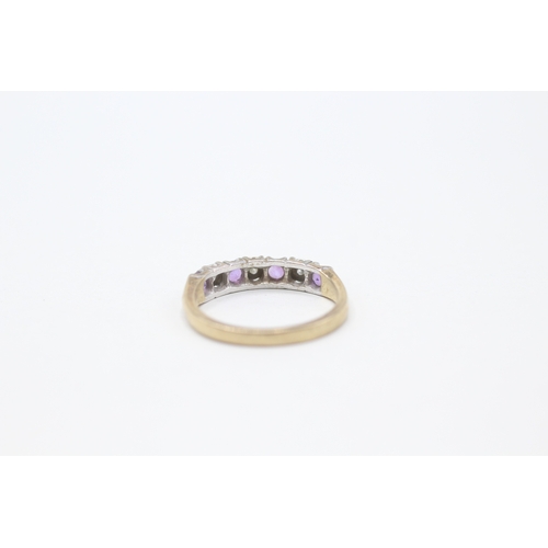 186 - 9ct gold diamond and amethyst row ring (2.2g) Size L