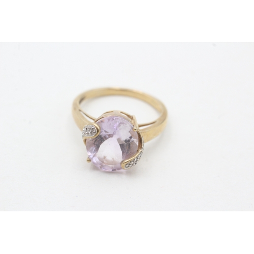 200 - 9ct gold amethyst single stone ring with diamond highlight (3.2g) Size N