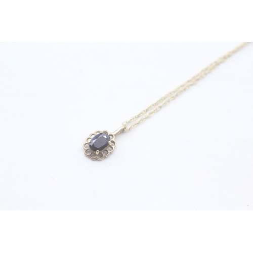 37 - 9ct gold sapphire pendant on chain (1.3g)