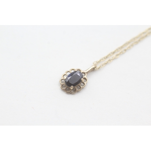 37 - 9ct gold sapphire pendant on chain (1.3g)