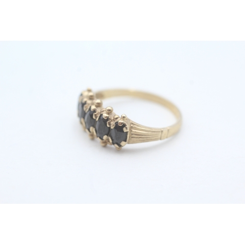 47 - 9ct gold and five stone sapphire ring (2.1g) Size M