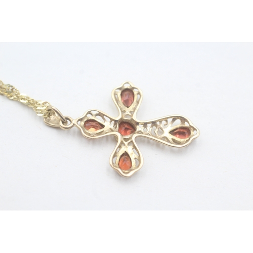 49 - 9ct gold and garnet cross pendant on chain (3.2g)