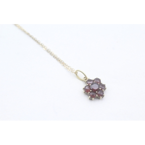 55 - 9ct gold and garnet flower cluster pedant on chain (1.6g)