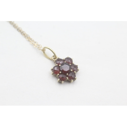 55 - 9ct gold and garnet flower cluster pedant on chain (1.6g)