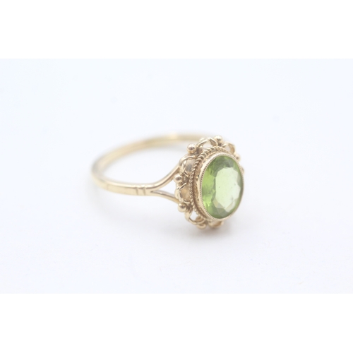 56 - 9ct gold and peridot ring (2.9g) Size P