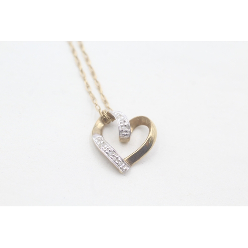 57 - 9ct gold heart shaped diamond pendant on chain (1.4g)