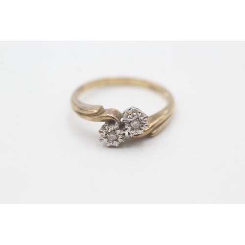 59 - 9ct gold two stone diamond ring (2.4g) Size P