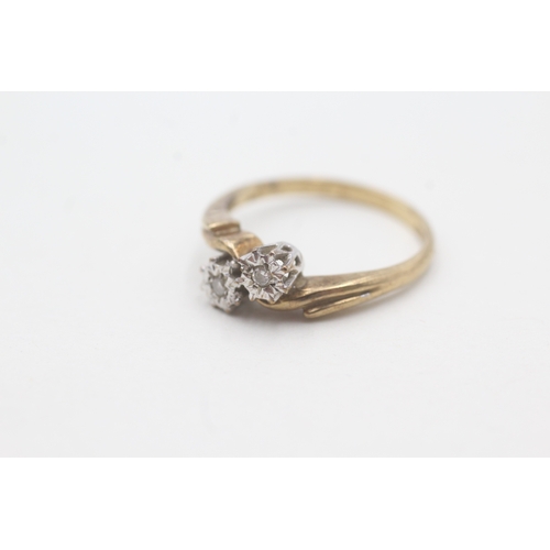 59 - 9ct gold two stone diamond ring (2.4g) Size P