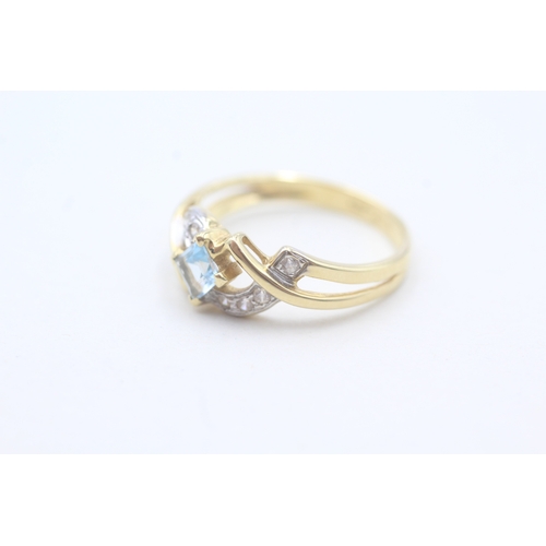 61 - 18ct gold blue topaz and cubic zirconia ring (3.1g) Size O