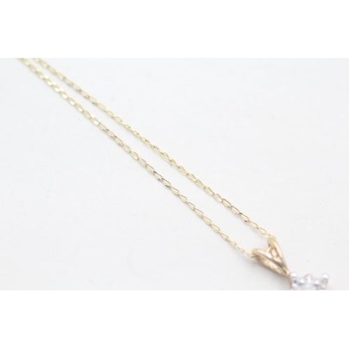 68 - 9ct gold single diamond pendant on chain (1.2g)