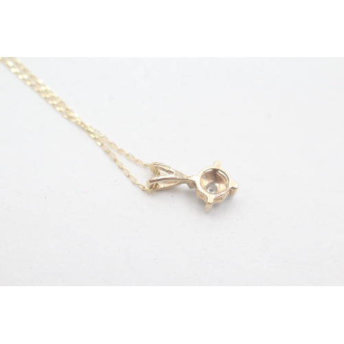 68 - 9ct gold single diamond pendant on chain (1.2g)