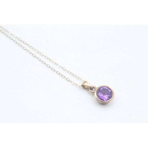 72 - 9ct gold amethyst pendant on chain (1.6g)