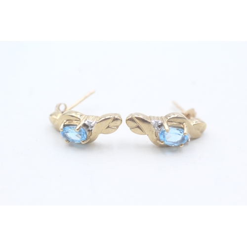 81 - 9ct gold blue topaz and diamond stud earrings (2.7g)