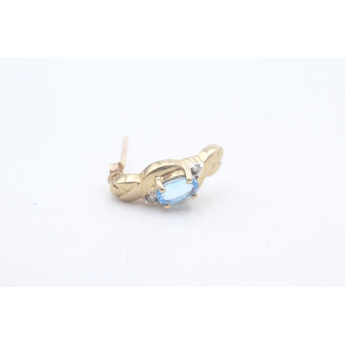 81 - 9ct gold blue topaz and diamond stud earrings (2.7g)