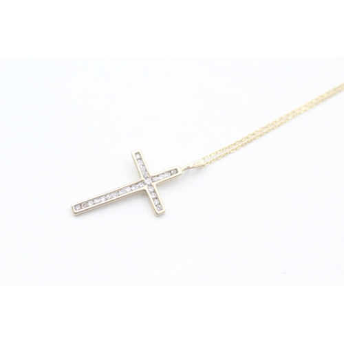 86 - 9ct gold diamond cross pendant on chain (2g)