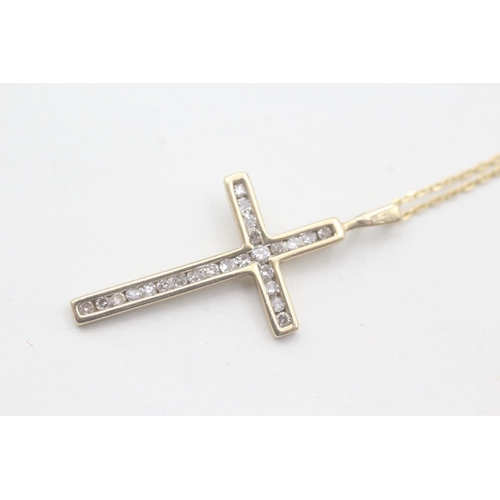 86 - 9ct gold diamond cross pendant on chain (2g)