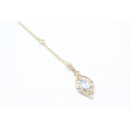 90 - 9ct gold and blue topaz pendant on chain (1.8g)