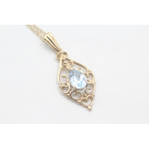 90 - 9ct gold and blue topaz pendant on chain (1.8g)