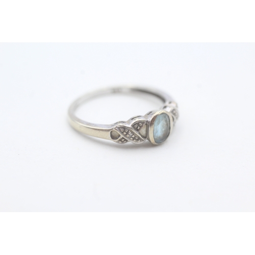 99 - 9ct gold blue topaz and diamond ring (1.7g) Size N