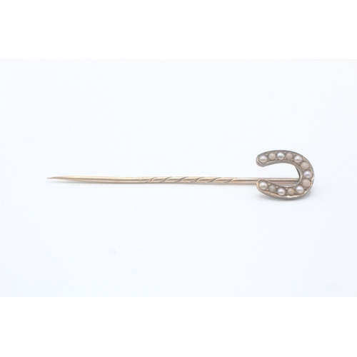 232 - 15ct gold antique seed pearl horseshoe stick pin with a 9ct gold pin (1.9g)