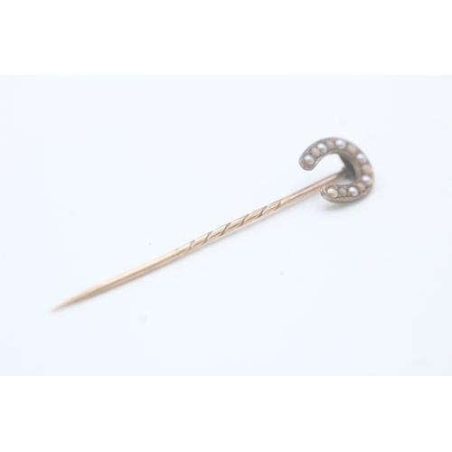 232 - 15ct gold antique seed pearl horseshoe stick pin with a 9ct gold pin (1.9g)