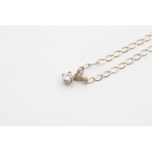 242 - 9ct gold single diamond pendant on chain (1.1g)