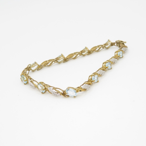 22 - 9ct gold blue topaz & diamond bracelet (7g)