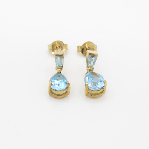 61 - 9ct gold and blue topaz drop stud earrings (1.6g)