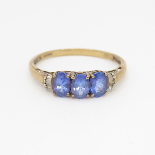 82 - 9ct gold tanzanite three stone ring with calibre cut diamond sides (2g) Size V