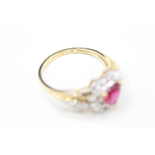 16 - 9ct gold diamond and red gemstone heart ring (2.7g) Size P