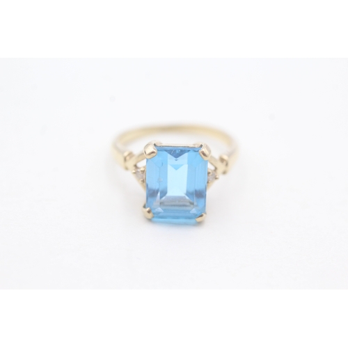 21 - 9ct gold claw set topaz and diamond ring (2.8g) Size K