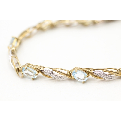 22 - 9ct gold blue topaz & diamond bracelet (7g)