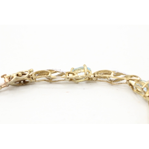 22 - 9ct gold blue topaz & diamond bracelet (7g)