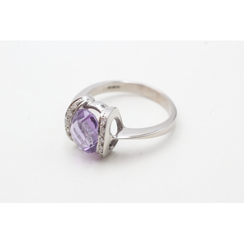 42 - 18ct white gold amethyst single stone ring with diamond highlight (5.4g) Size S