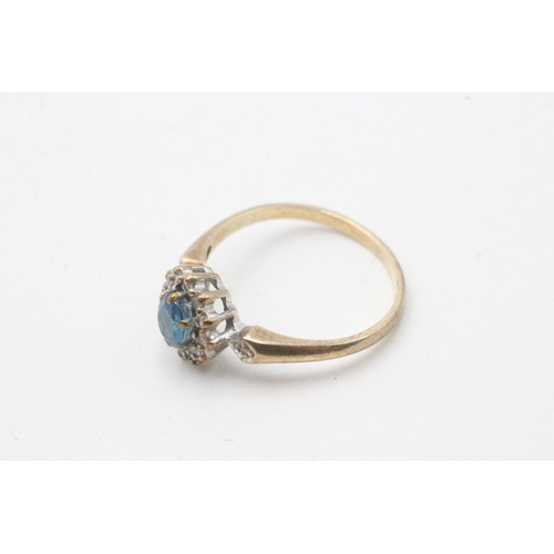 51 - 9ct gold blue topaz and diamond halo set ring (1.8g) Size M