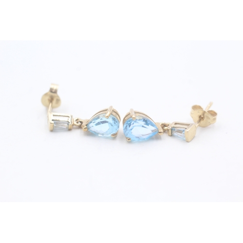 61 - 9ct gold and blue topaz drop stud earrings (1.6g)