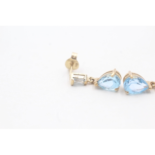 61 - 9ct gold and blue topaz drop stud earrings (1.6g)