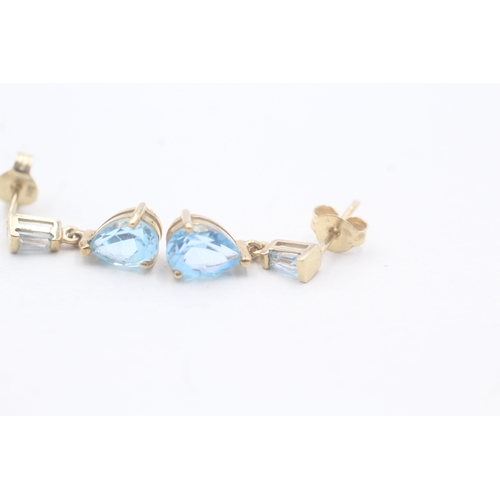 61 - 9ct gold and blue topaz drop stud earrings (1.6g)