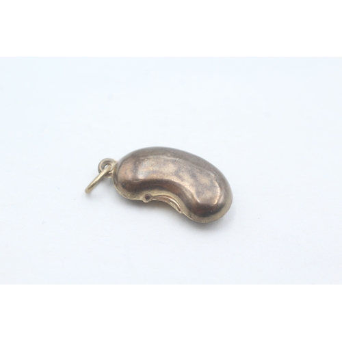 63 - 9ct gold vintage lucky bean charm (0.8g)